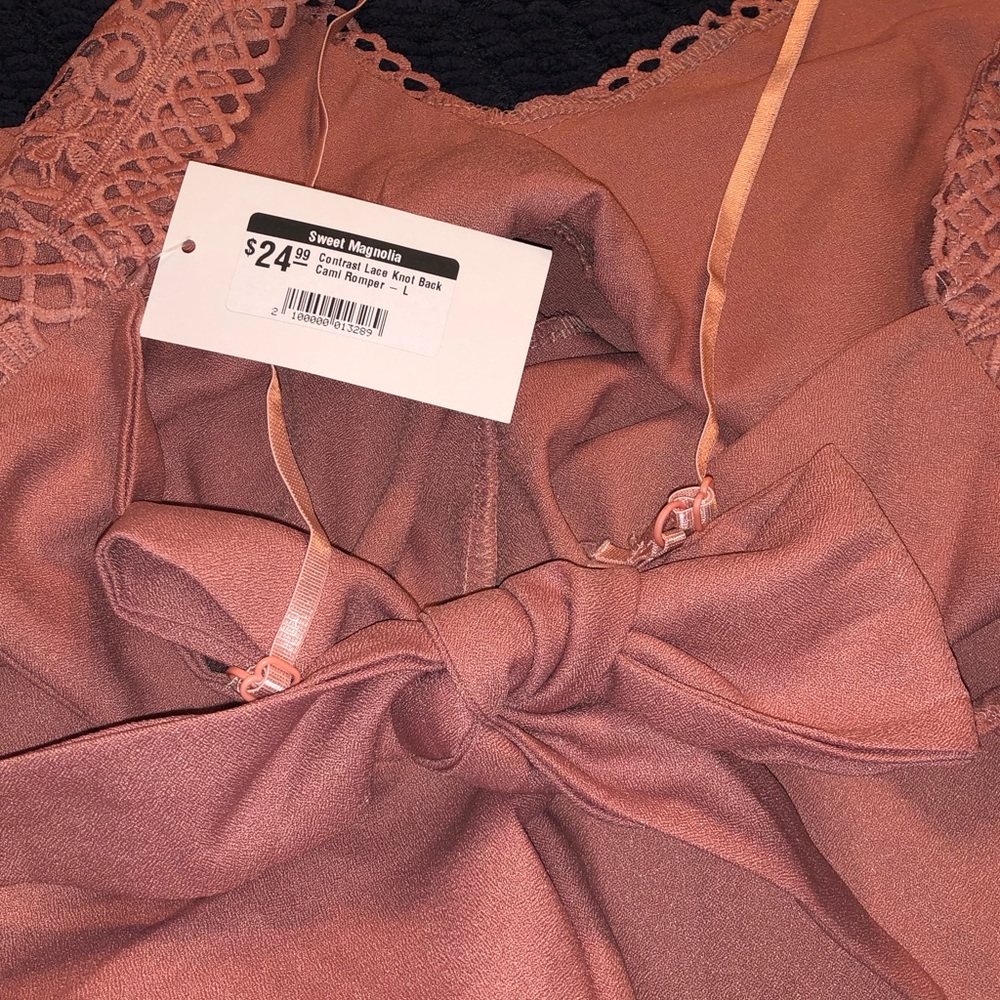 Blush romper new with tags never been worn!